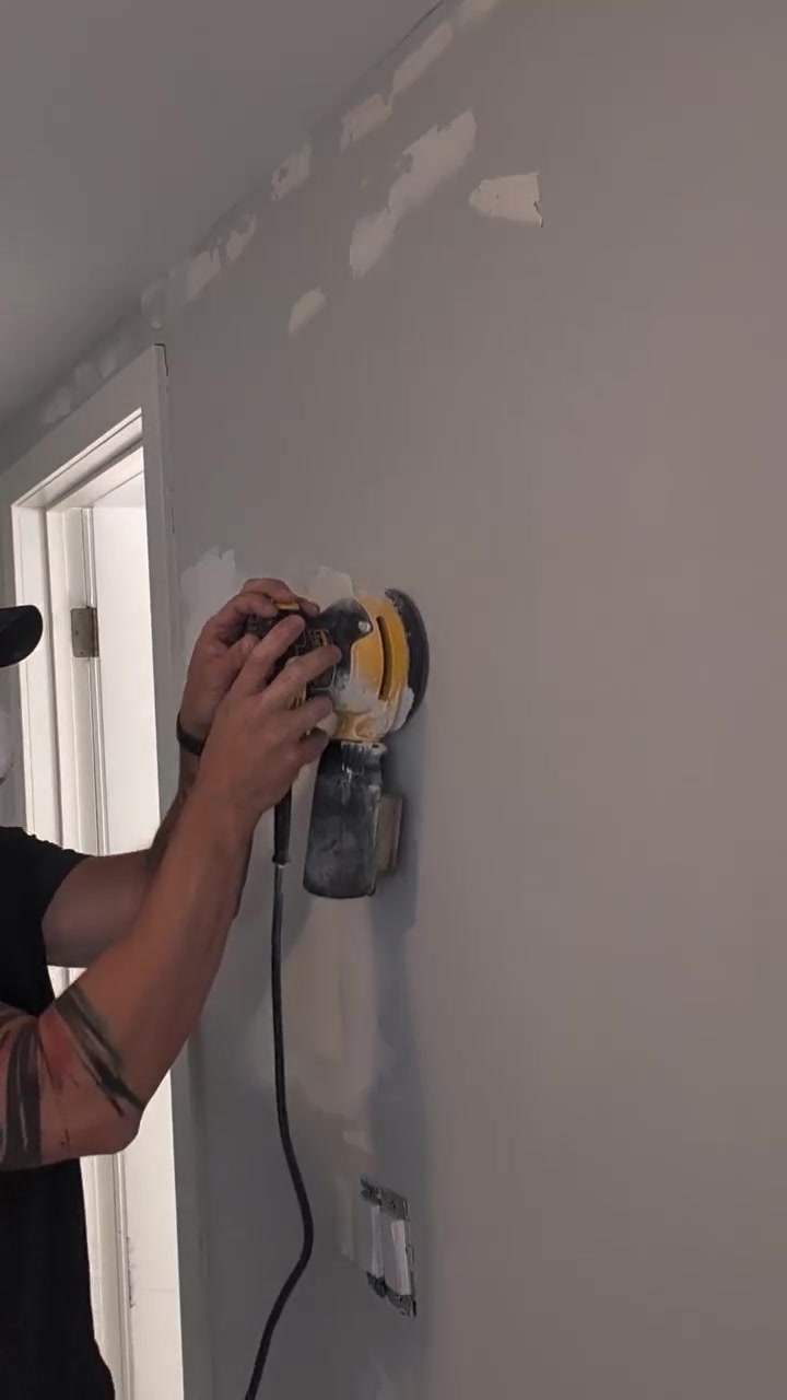 TrueForma sanding patched drywall on an interior painting project